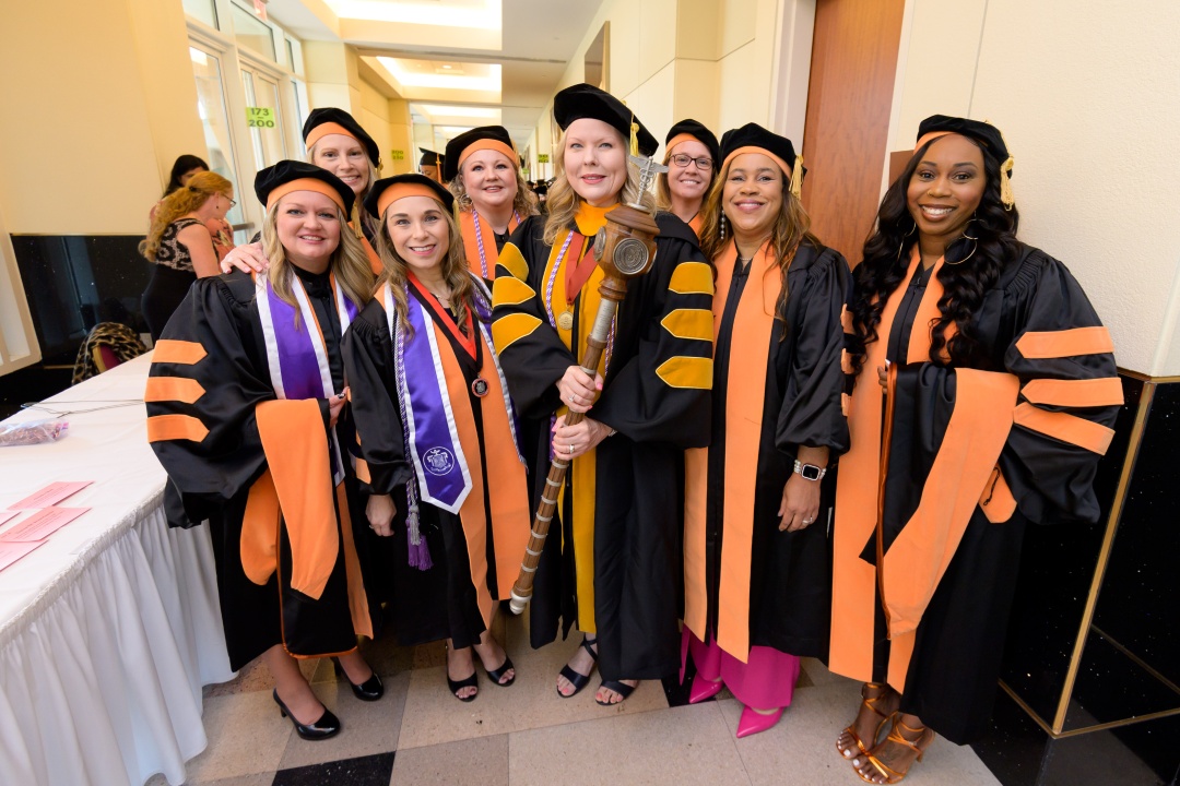 Doctor of Nursing Practice students pose together during the 2025 UTMB School of Nursing commencement ceremony.